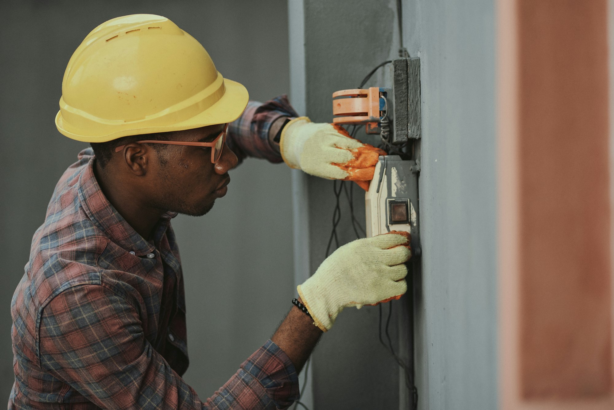 Engineer using safety equipment during electrical work